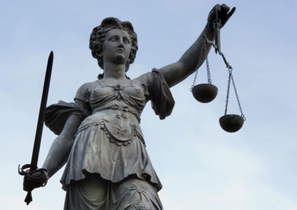 Photo of Lady Justice by  Roland Meinecke,  licensed under Free Art license.