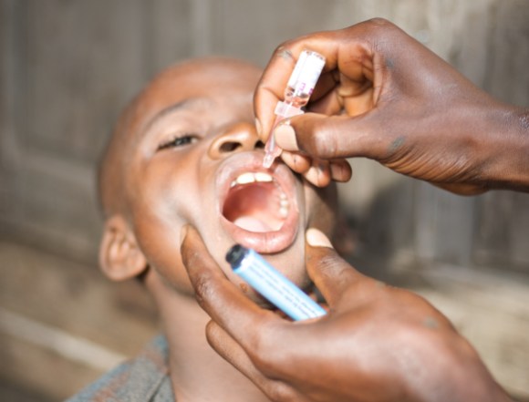 A polio vaccination in Conakry, Guinea. Photo by Julien Harneis, CC BY-SA 2.0.