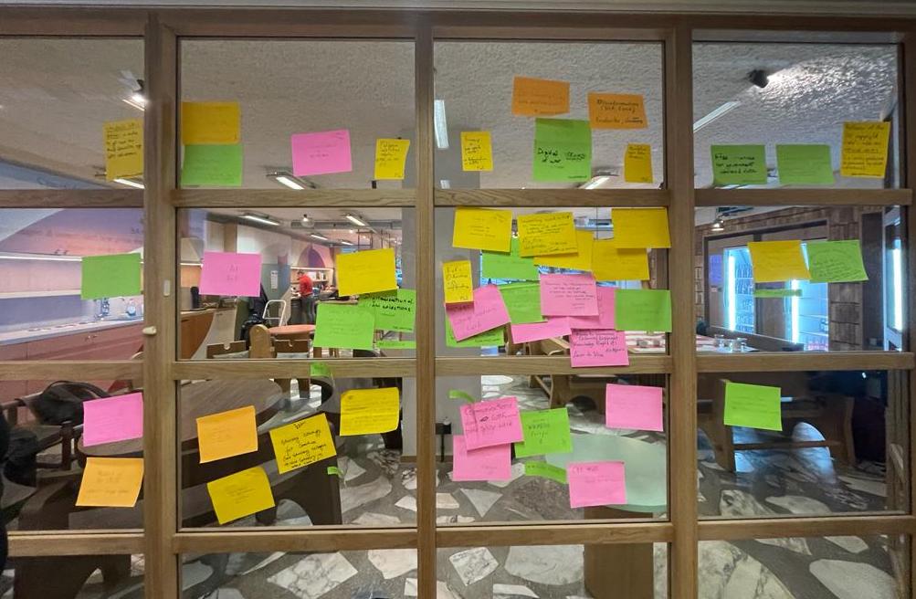 Post-it notes identifying EU policy priorities from Brussels meeting.