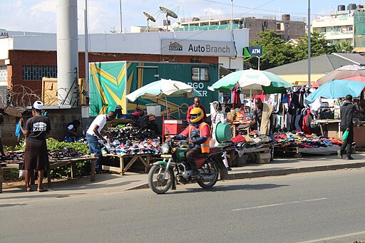 A Boda Boda motorcycle taxi rider navigating through the streets of Nairobi.